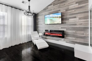 Smart TV, fireplace, books, offices