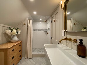 Bathtub, hair dryer, towels, soap