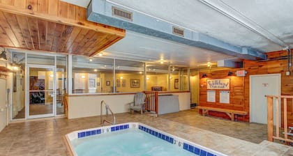 Ski-in/out condo with pool, hot tub, game room, mountain view, & fireplace