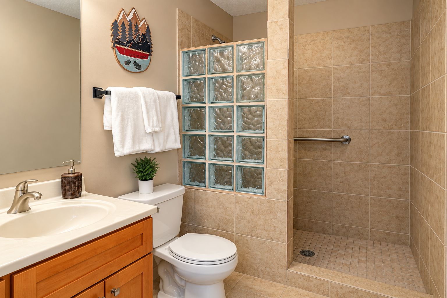A bathroom with a toilet, sink, and shower.