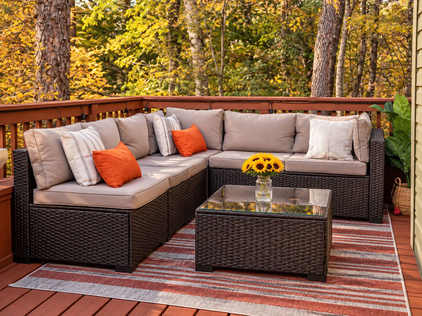Cozy wooded deck with comfy sectional seating and peaceful fall views
