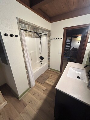 Combined shower/tub, hair dryer, towels, soap