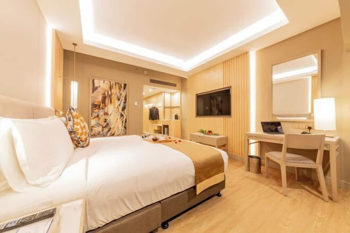 Minibar, desk, laptop workspace, iron/ironing board