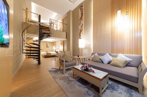 Exclusive Studio Suite, 2 Bedrooms | Living area | 32-inch LCD TV with cable channels, TV