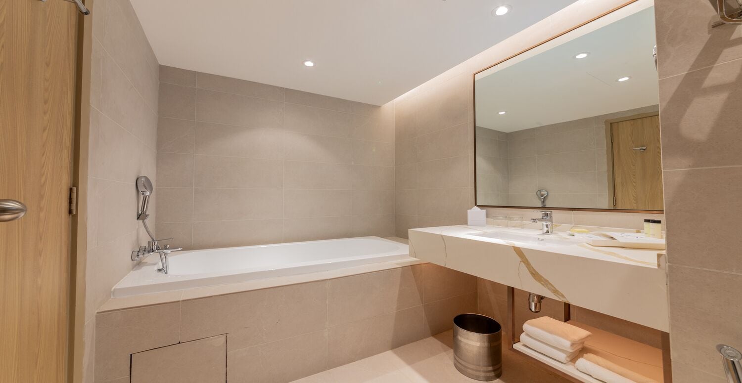 rainfall showerhead, hair dryer, bathrobes, slippers