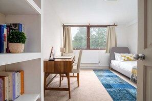 Basic Apartment, Multiple Beds | Living room | TV, books
