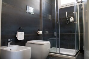 Shower, rainfall showerhead, designer toiletries, hair dryer