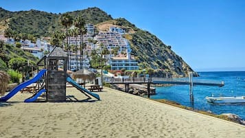 Enjoy beach activities and water sports from the resort's pier, with a children's play area nearby.
