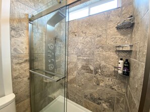 Shower, hair dryer, towels, soap
