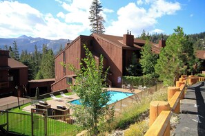 Relax by the pool surrounded by a lush lawn and breathtaking mountain views.