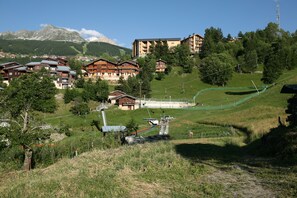 Guests can enjoy mountain views from the balconies of our rooms, surrounded by lush greenery and trees.