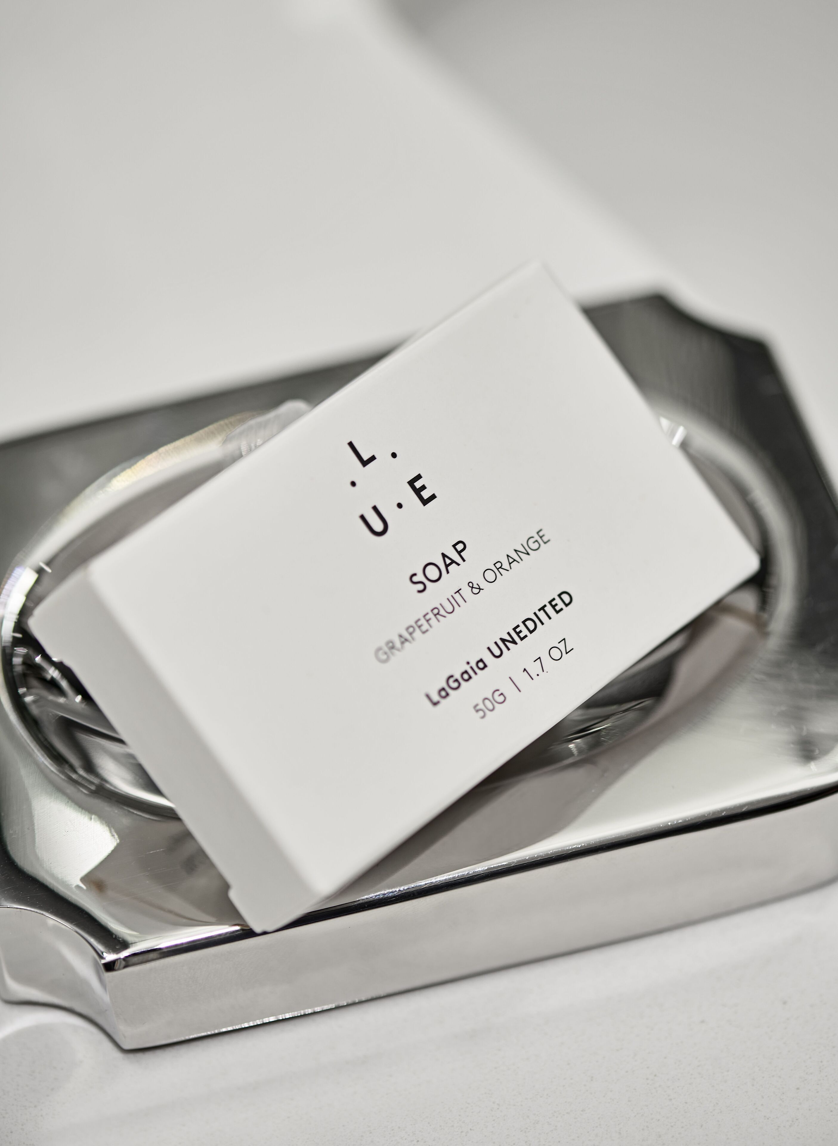 designer toiletries, hair dryer, bathrobes, slippers