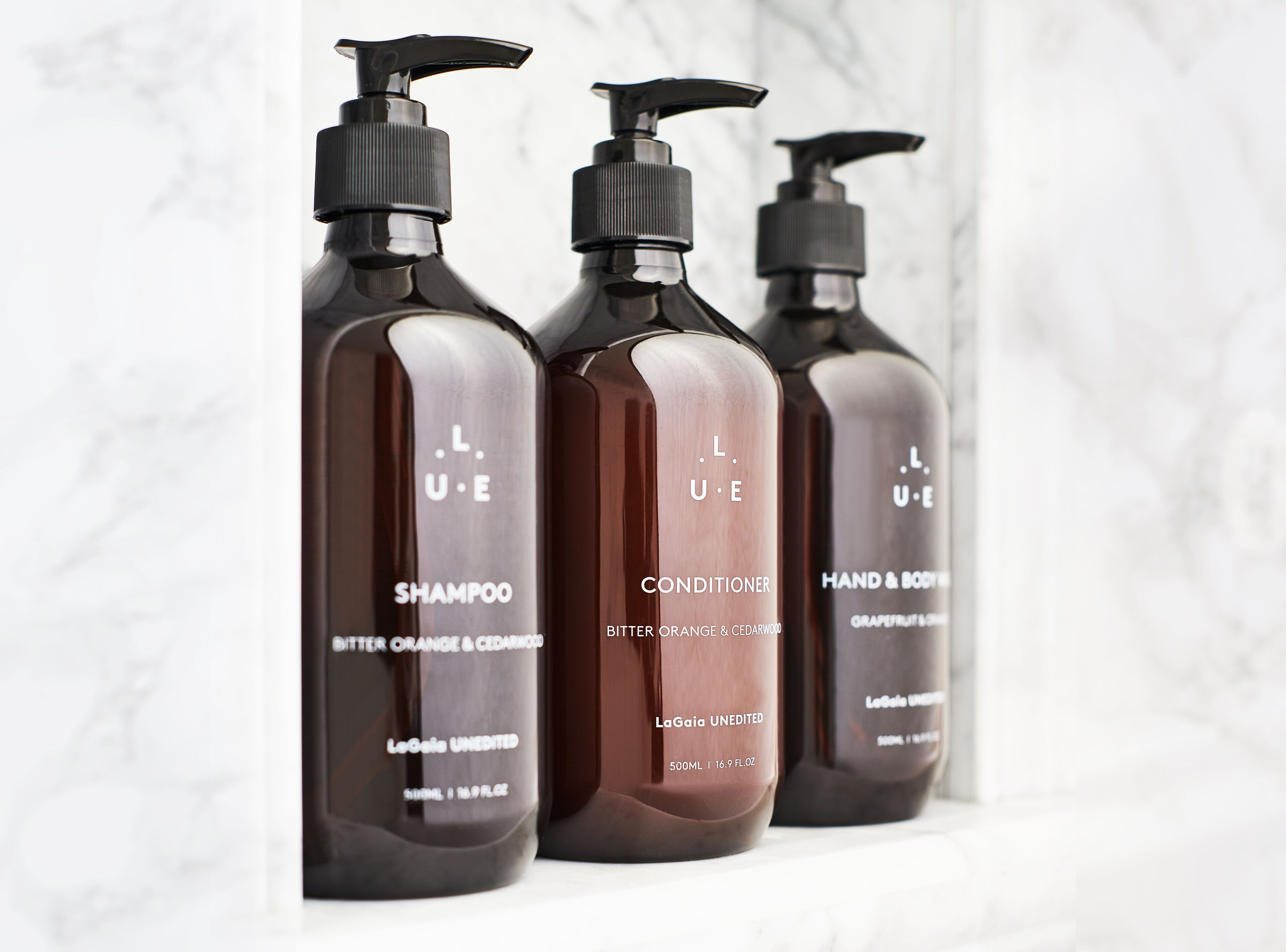 designer toiletries, hair dryer, bathrobes, slippers