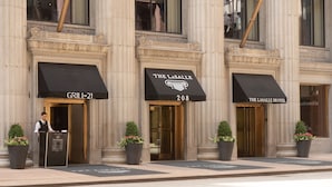 A hotel entrance with a sign reading "The Lasalle Hotel" and a "Grill on 21" sign. - The LaSalle Chicago, Autograph Collection by Marriott (Chicago)