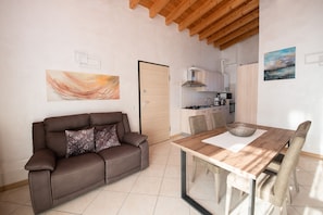 Family Apartment | Living area | 50-inch TV with cable channels