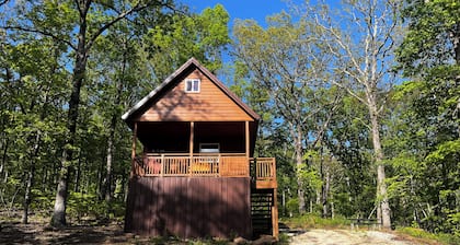Cowboy Cabin is a quiet place to camp in the woods with the amenities of home.