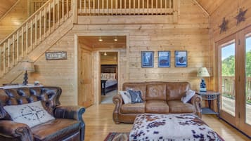 Cabin, 1 King Bed with Sofa bed, Hot Tub | Living room | 40-inch TV with cable channels, fireplace