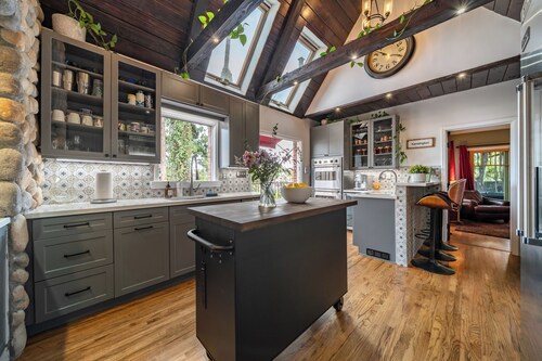 THE KENSINGTON CANYON ESTATE- A Spacious Historic Resort Style Tudor Retreat