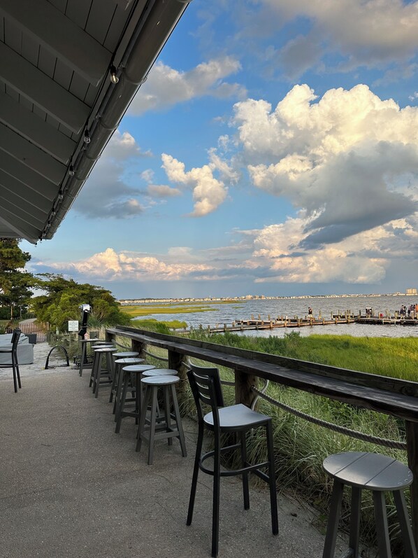 Outdoor dining - Bayside Resort! Spacious Townhome-Sleeps 13-Pools, Beach, Bikes, Pond, Golf! (Selbyville)