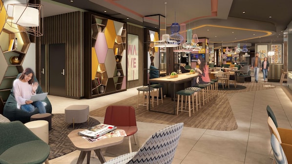 Ein stilvoller Lounge-Bereich mit Sitzgelegenheiten, einer Bar und einer Zeitschriftenauslage.