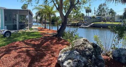 Fully remodeled, adorable coastal canal house on a spacious corner lot.