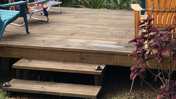 A wooden deck with lounge chairs and a picnic table, overlooking a lush green valley and mountains. - Live Tropical like a local , El Yunque Rainforest View, Mountain View  (Río Grande)