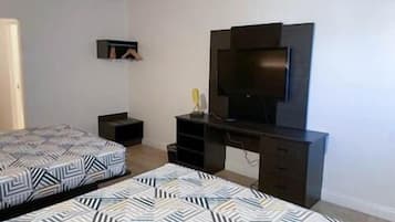 Premium bedding, desk, laptop workspace, free WiFi
