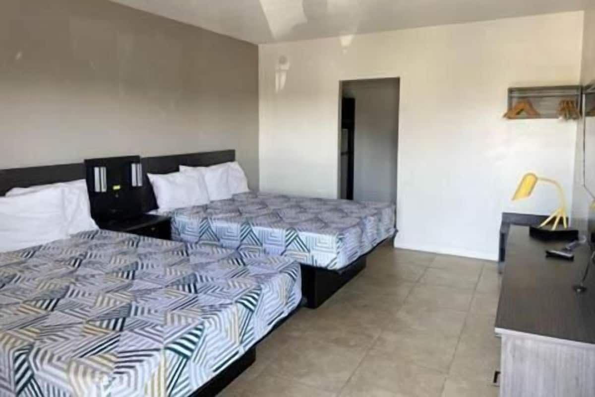 Premium bedding, desk, laptop workspace, free WiFi