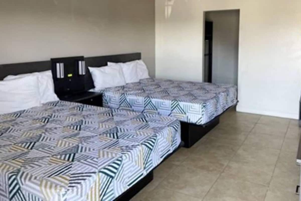 Premium bedding, desk, laptop workspace, free WiFi