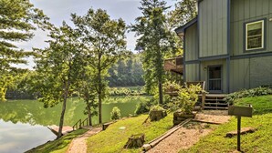 A lakeside cabin with a deck, a dock, and a mailbox. - Lake Santeetlah Escape w/ Kayaks, Boat Slip & More (Robbinsville)
