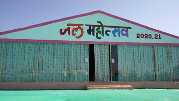 A building with a sign reading "Jai Mata Dev" and the year "2020.21".