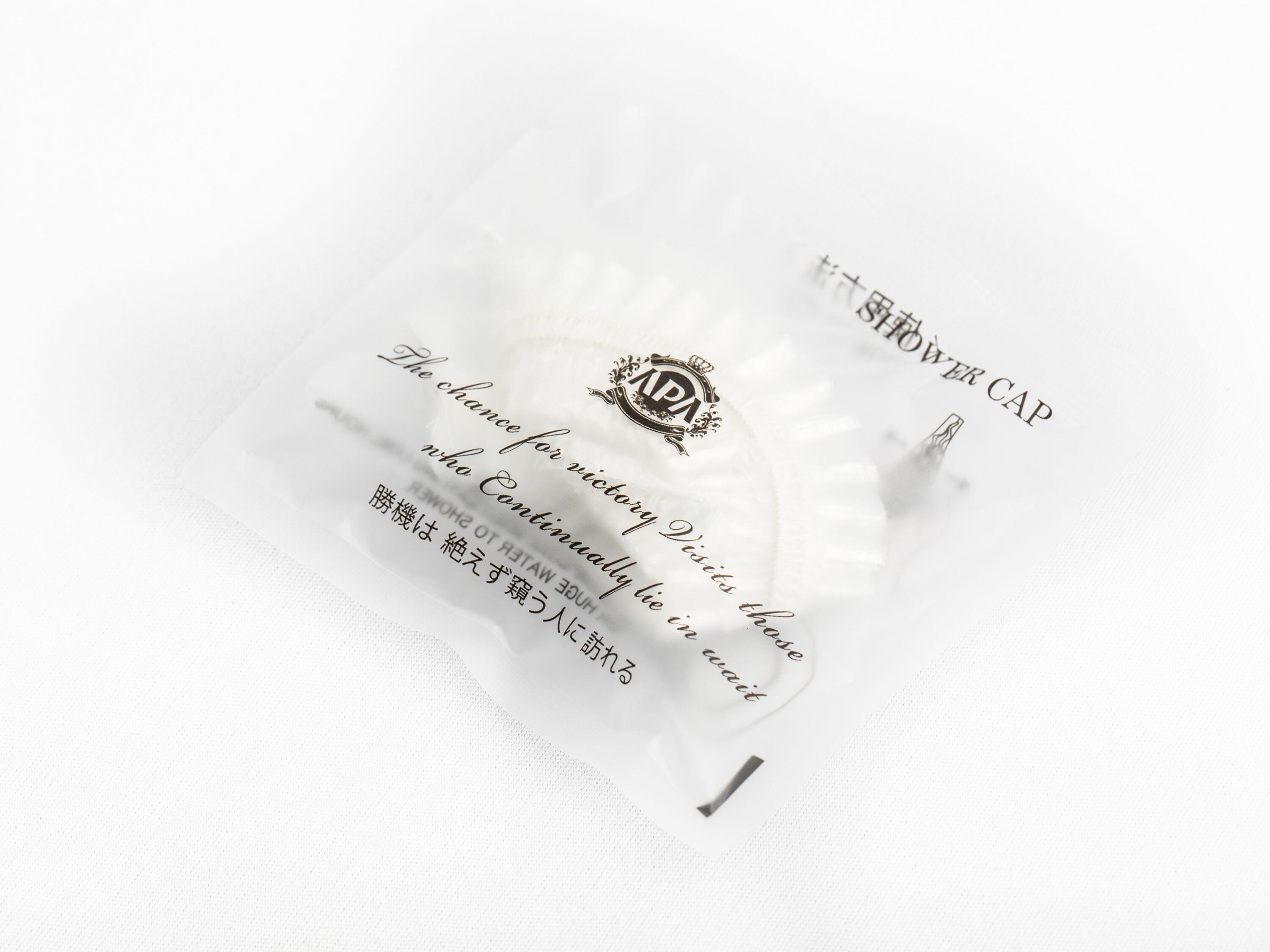 A white pillow with text and a logo.