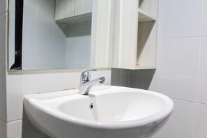 Habitación | Baño | Regadera y toallas