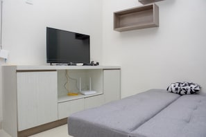 Room | Living room - Homey And Cozy Living 1Br Apartment At Atlanta Residences (Depok)