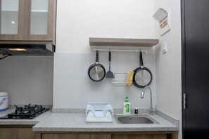 Room | Private kitchen - Homey And Cozy Living 1Br Apartment At Atlanta Residences (Depok)