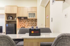 Enjoy a home away from home with a kitchenette, sofa, and complimentary food and beverage.
