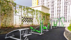 An outdoor gym area with exercise equipment and a climbing wall. - Comfy With Modern Style Springlake Summarecon Studio Apartment (Bekasi)