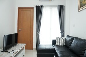 Living room - Minimalist And Cozy 2Br Apartment At The Nest Near Puri By Travelio (Tangerang)