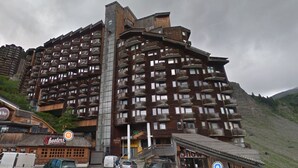 A multi-story hotel with balconies and a ski resort sign. - Avoriaz: Wellness space, 8 pers, 90 sqm (Avoriaz)