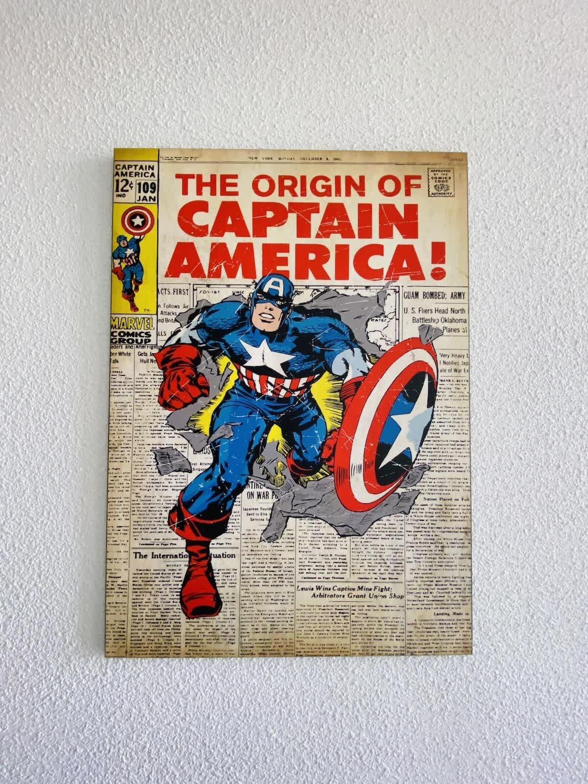 Capa de revista em quadrinhos do Capitão América, com um título grande, um personagem num traje azul e um escudo.