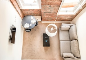 Grand Apartment, 1 Bedroom, City View | Living area | 35-inch TV with cable channels