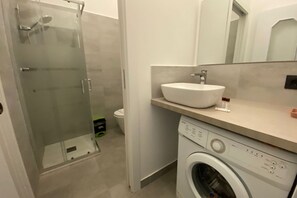 Bathtub, hair dryer, bidet