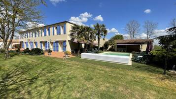 Relax in a serene outdoor space with a swimming pool and comfortable seating areas.