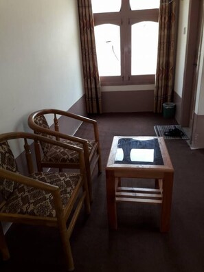 Standard Triple Room | Living area | TV