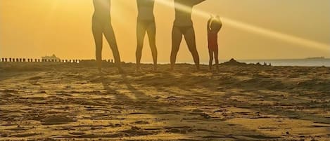 On the beach, sun loungers, beach towels