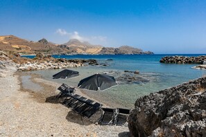 On the beach, sun loungers, beach towels