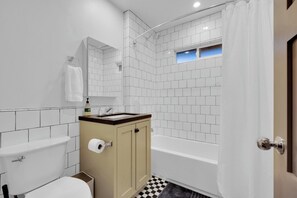 Bathtub, hair dryer, towels