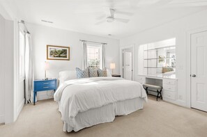 A bedroom with a bed, a nightstand, a dresser, a ceiling fan, and a window with curtains. - Mansion in Southern Pines - Saltwater Pool, Farm Animals, Golf (Southern Pines)