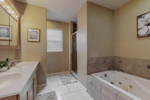 Bathtub, towels, soap, shampoo