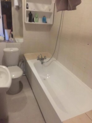 Bathtub, hair dryer, towels, soap